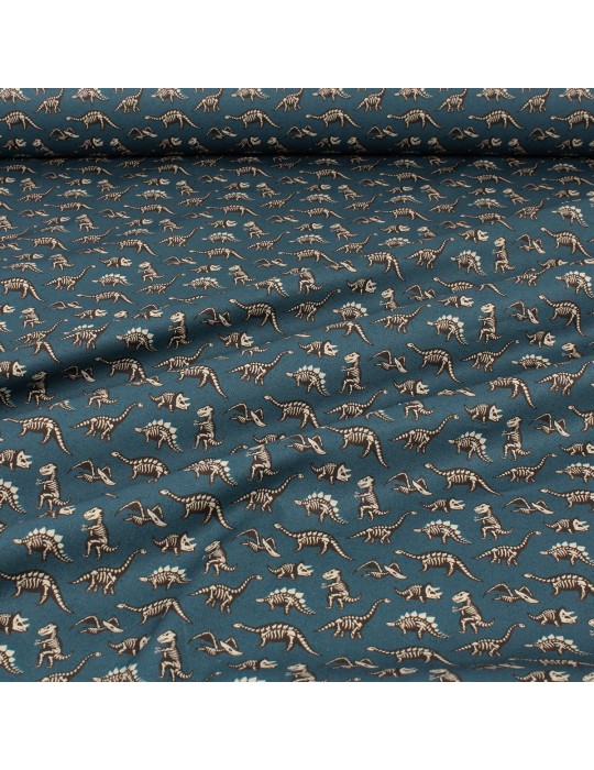 Tissu cretonne imprimé squelettes dinosaures bleu