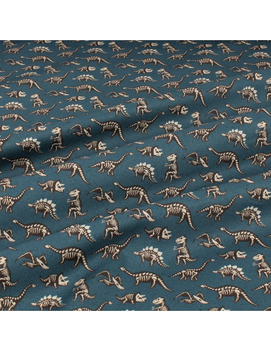 Tissu cretonne imprimé squelettes dinosaures bleu